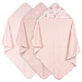 Three pink hooded towels with floral patterns on a white background