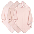 Three pink hooded towels with floral patterns on a white background