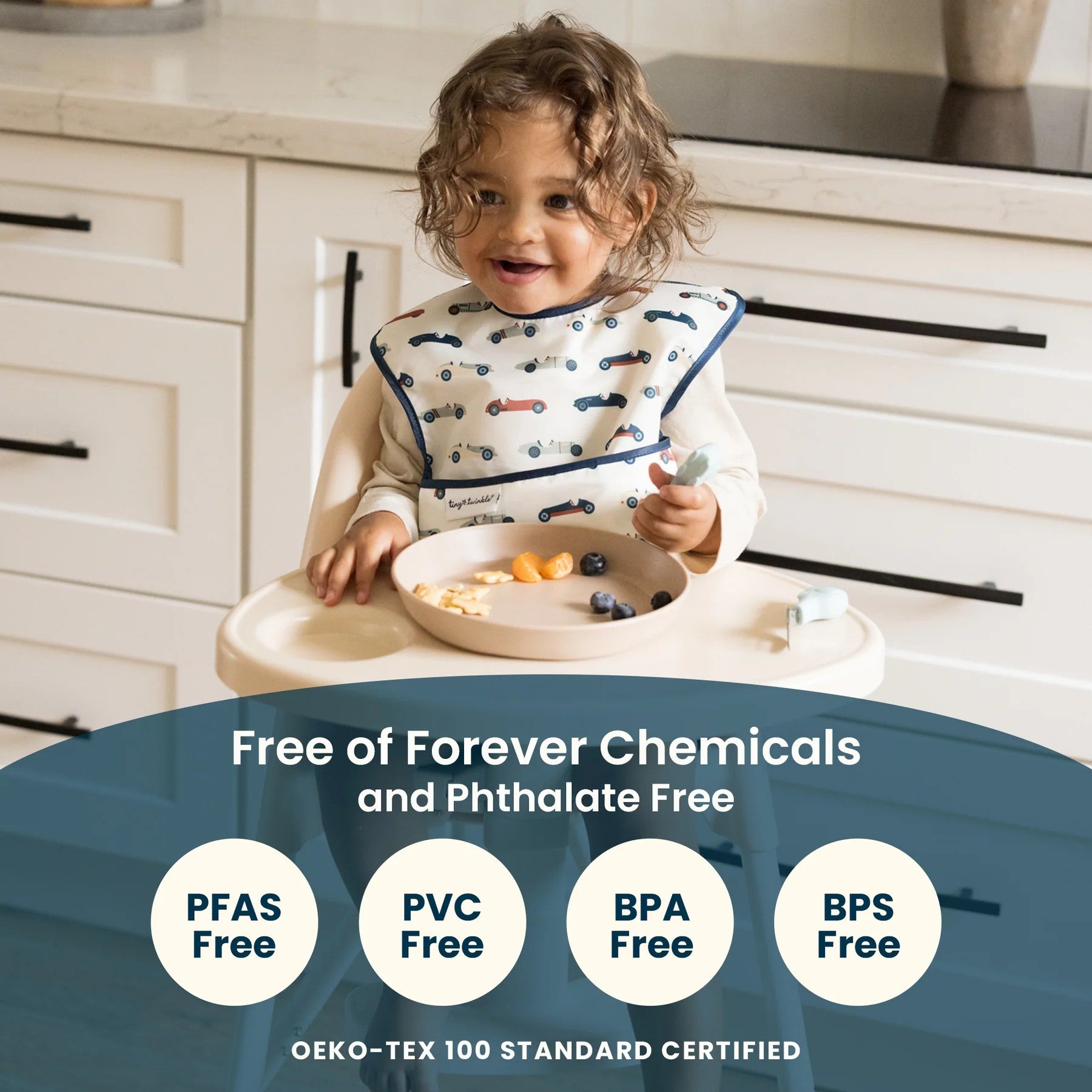 Child in a kitchen wearing a bib with food on a tray, surrounded by text about chemical free products.