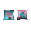 Two sequin pillows with unicorn design on a white background