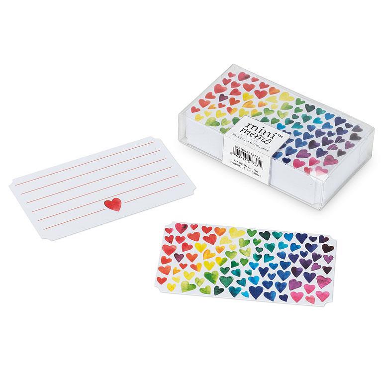 Colorful heart-patterned notepads with a box on a white background