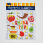 Kit of Rosh Hashanah gel decorations in a clear plastic bag with a blue and yellow header card. The decorations feature colorful glitter letters spelling 'Shana Tova' and festive holiday symbols including honey pots, apples, a pomegranate, a horn, and a bee on a white honeycomb background.