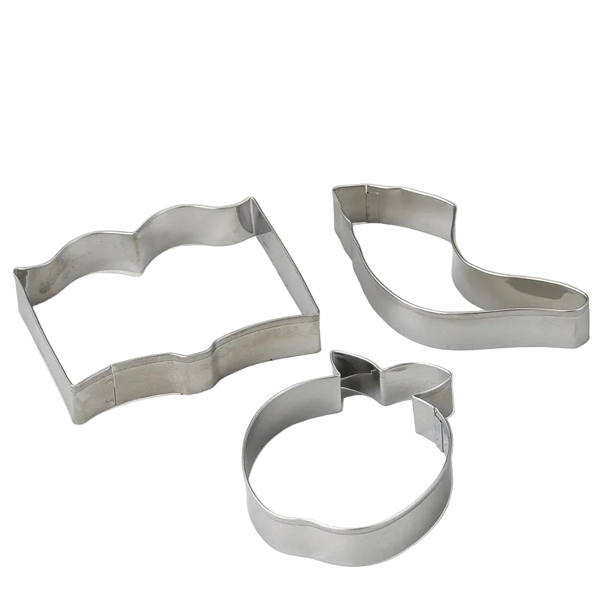 Three stainless steel cookie cutters in different shapes arranged on a plain white surface.