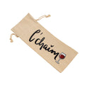A beige canvas wine bottle bag with a drawstring closure, featuring the word 'chaïm' in black script and a small red wine glass graphic, shown on a plain white background.