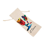 A beige canvas drawstring pouch featuring a colorful abstract painting of two wine glasses and the signature 'L. O'Marr' printed on the front, shown against a plain white background.