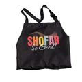 A black drawstring apron with adjustable shoulder straps, featuring a colorful graphic print on the front that reads 'SHOFAR So Good!' in red, orange, yellow, and white lettering, set against a plain white background.