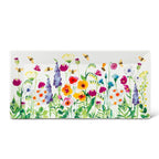Rectangular white plate with colorful floral design on a white background
