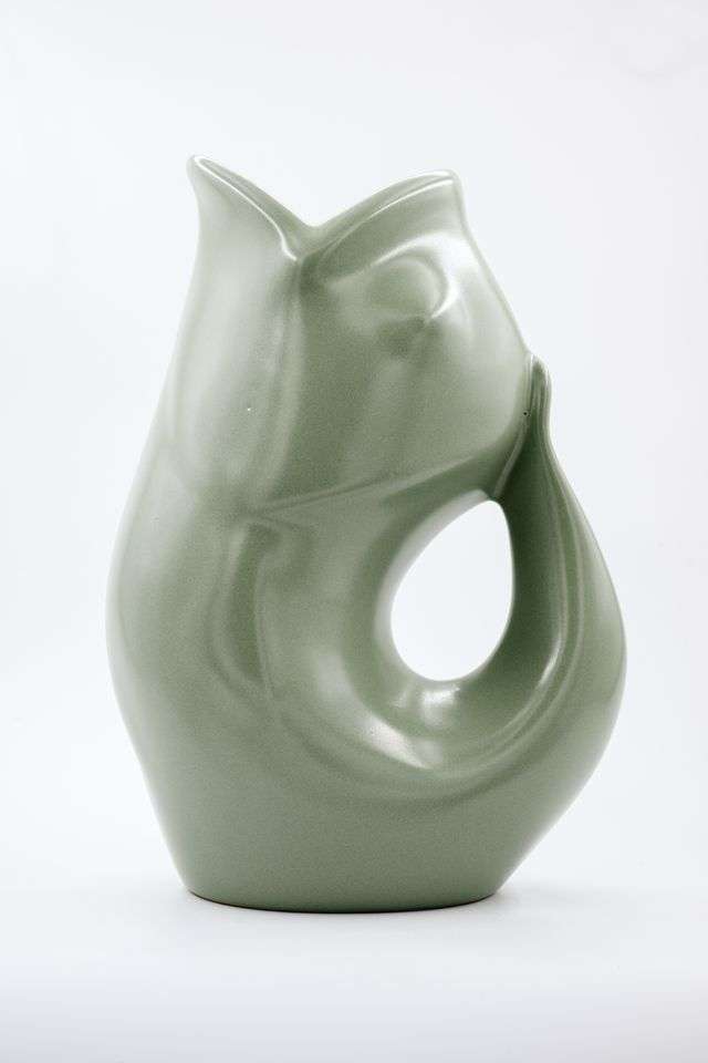 Gray ceramic fish-shaped vase on a white background
