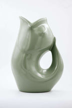 Gray ceramic fish-shaped vase on a white background