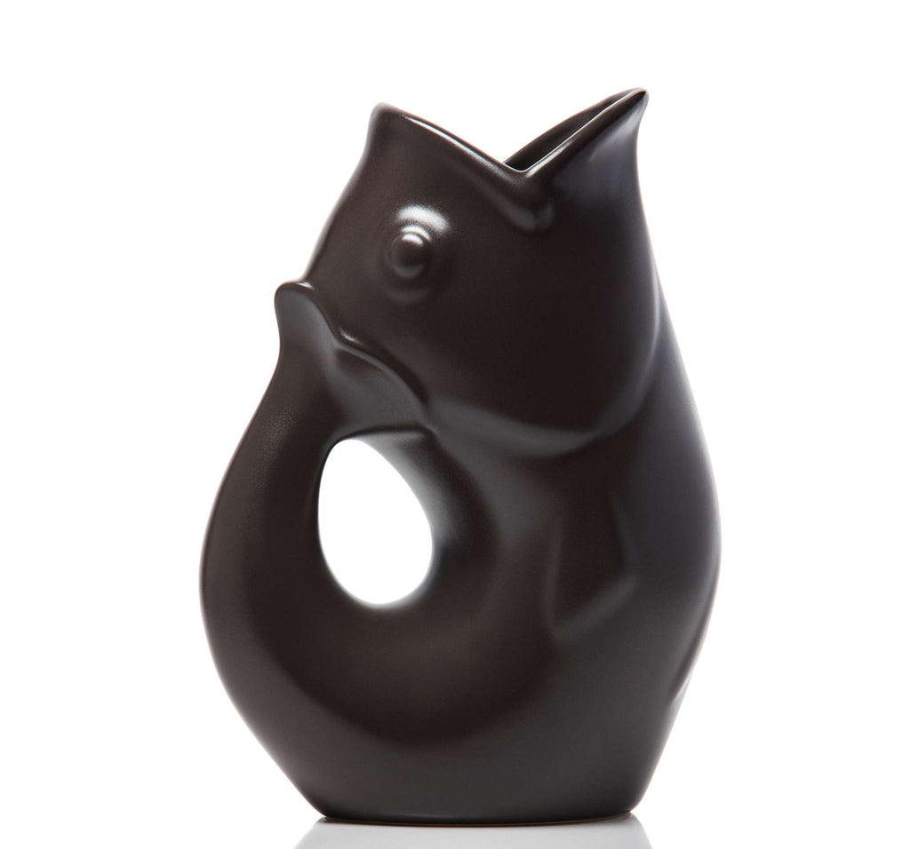 Black ceramic fish-shaped vase on a white background