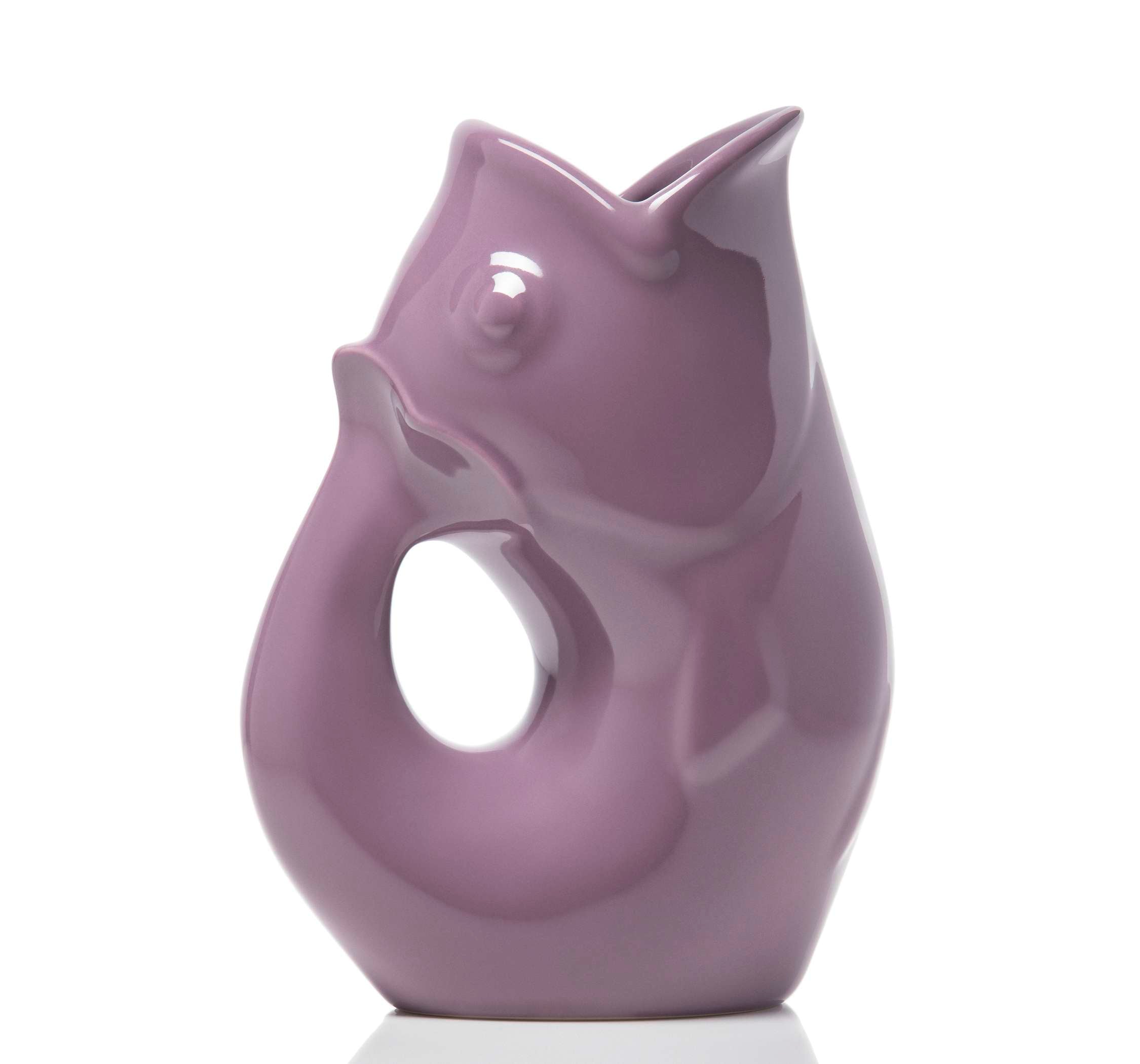 Purple ceramic vase shaped like a stylized fish on a white background