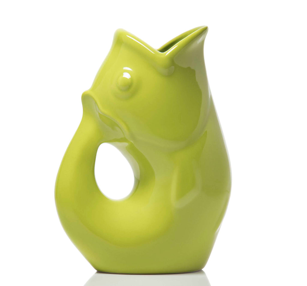 Green ceramic fish-shaped vase on a white background