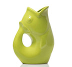 Green ceramic fish-shaped vase on a white background