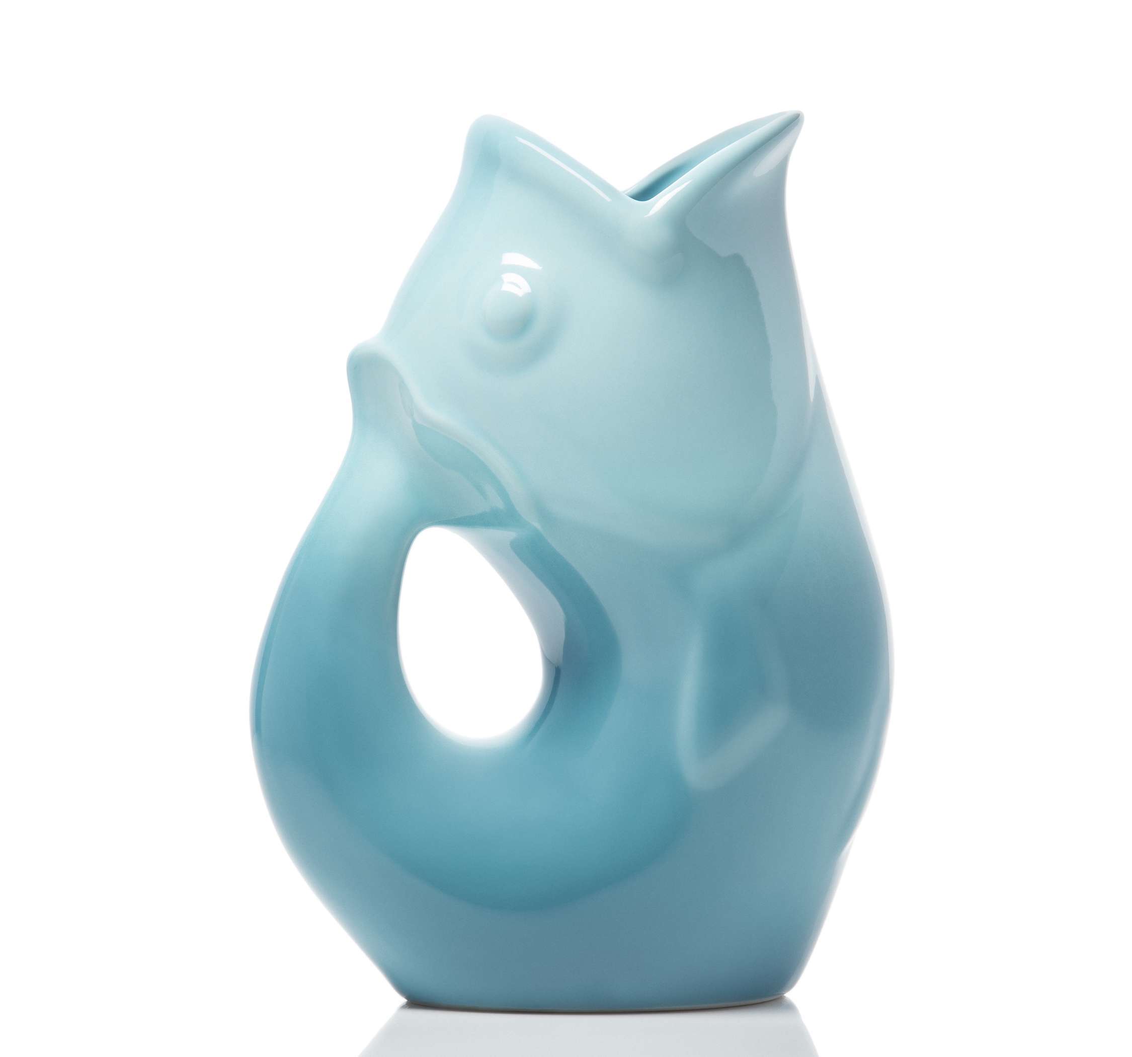 A glossy light blue ceramic fish-shaped pitcher with a small opening at the top, photographed on a clean white background.