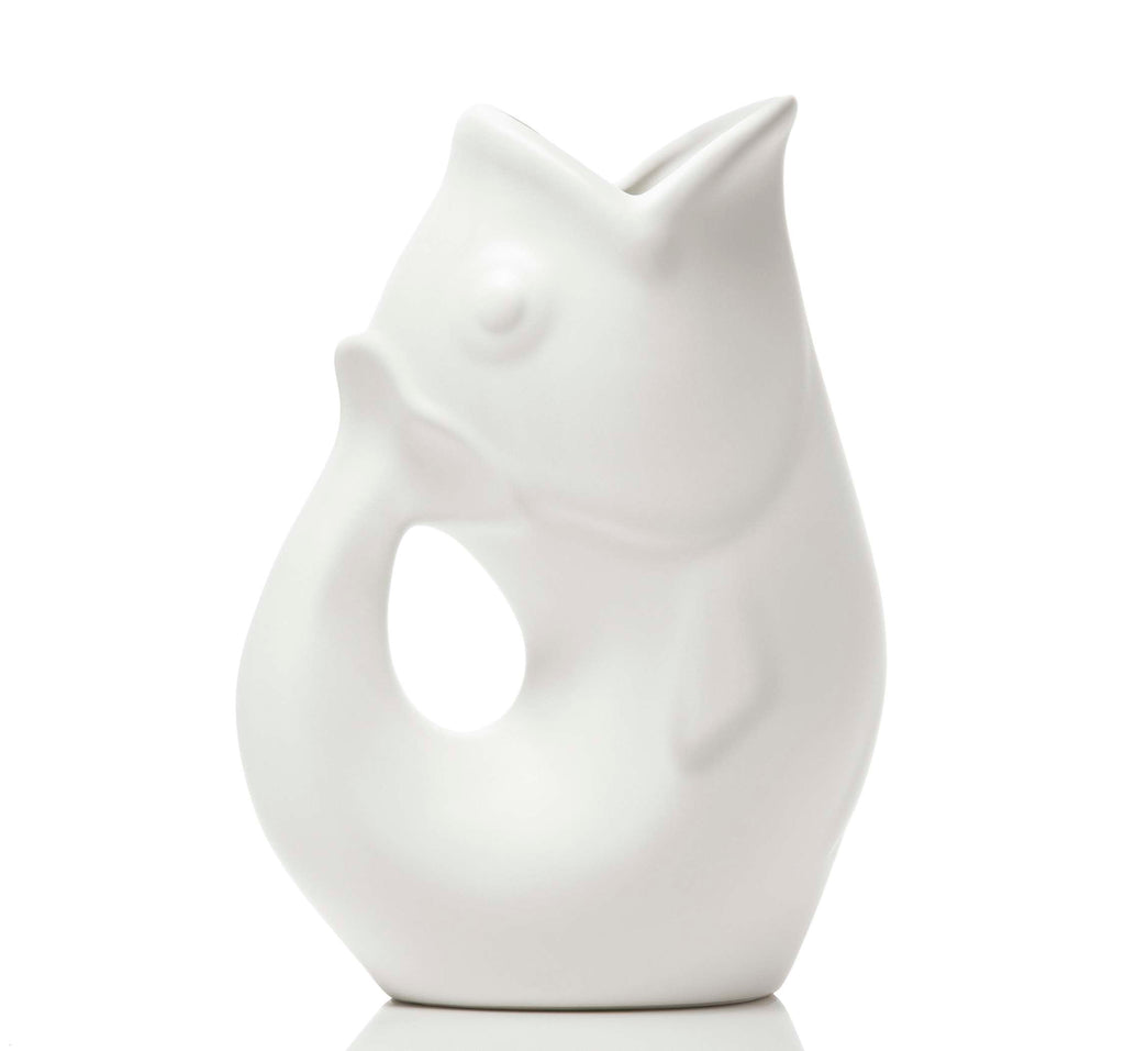 White ceramic vase shaped like a fish on a white background