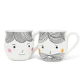 Two ceramic mugs with cartoon faces on a white background