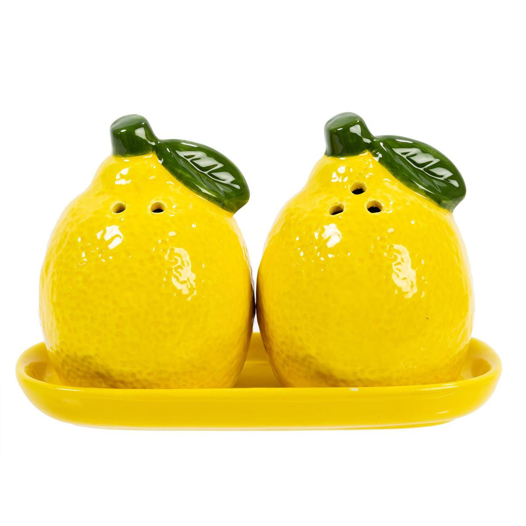 Two lemon-shaped salt and pepper shakers on a matching tray with a white background