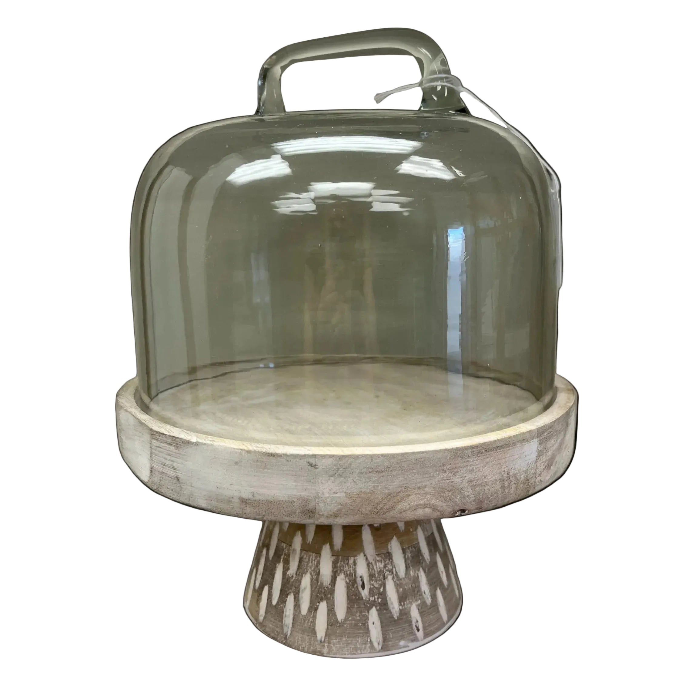 Decorative cake stand with glass dome on a white background