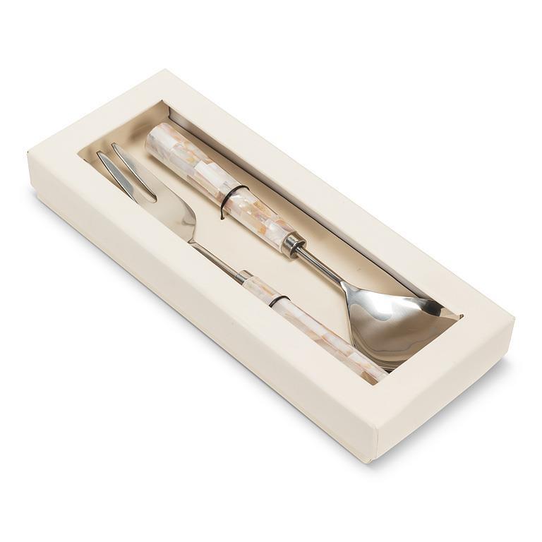 Set of cutlery in a decorative box on a white background