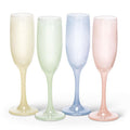 Four pastel-colored champagne flutes on a white background