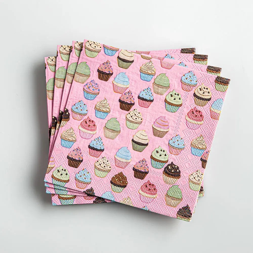 Set of pink napkins with colorful cupcake pattern on a light gray background