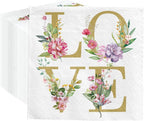 Napkin with floral design spelling 'LOVE' on a white background