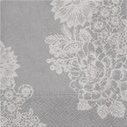 Floral lace patterned napkins on a textured gray background