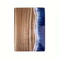 Wooden cutting board with a beach scene design on a white background