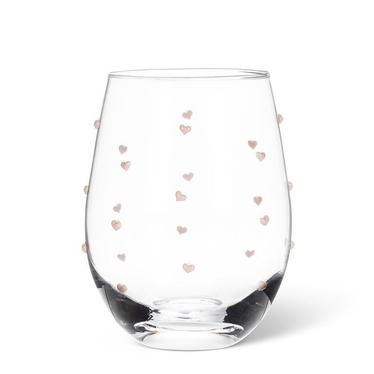 Clear glass with pink heart patterns on a white background