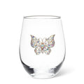Clear glass with a colorful butterfly embellishment on a white background