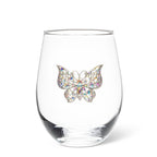 Clear glass with a colorful butterfly embellishment on a white background