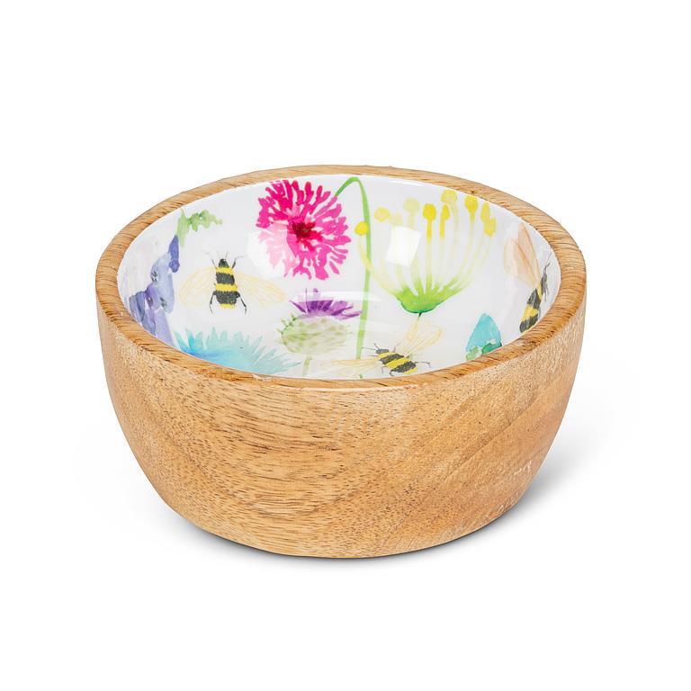 Wooden bowl with a colorful floral and bee pattern on a white background