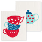 Two dishcloths with colorful cup designs on a white background