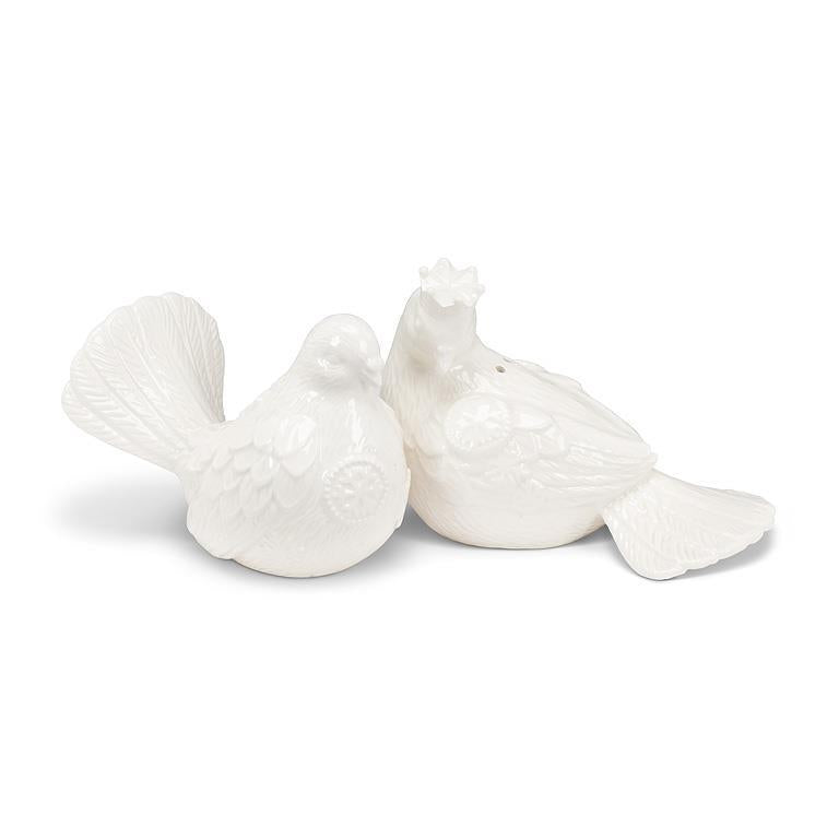 Two white ceramic birds-shaped salt and pepper shakers on a white background