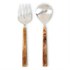 Silver fork and spoon with wooden handles on a white background