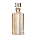 Gold glass decanter on a white background