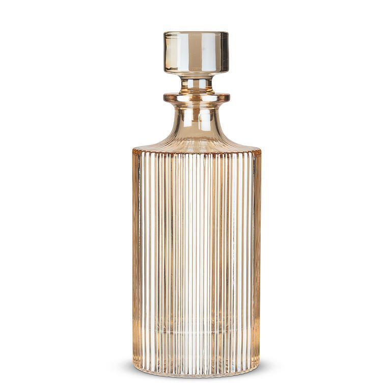Gold glass decanter on a white background
