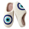 Pair of slippers with eye design on a white background