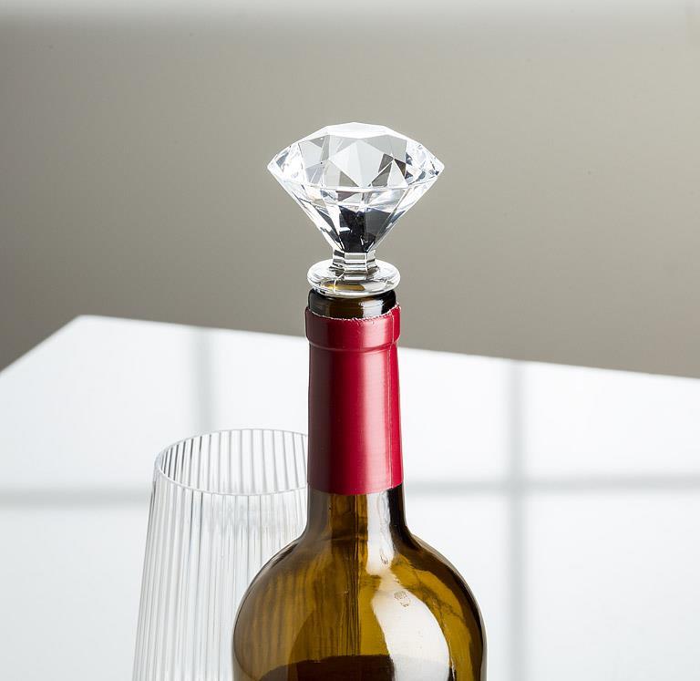 Wine bottle with a diamond-shaped bottle stopper on a neutral background