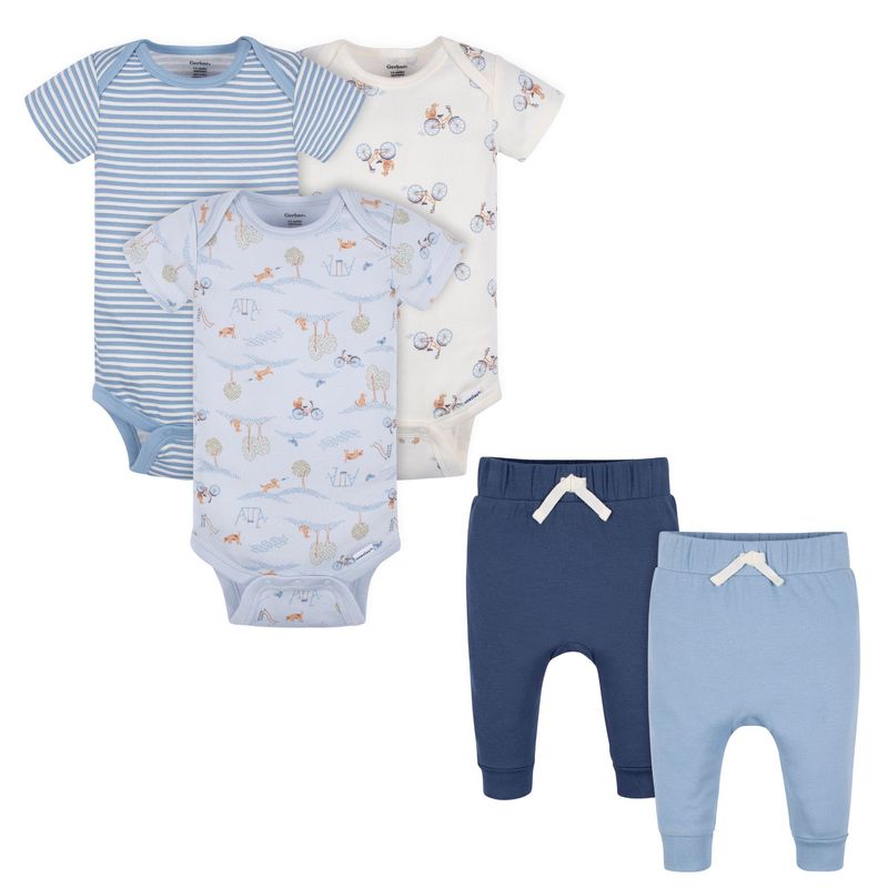 Set of baby clothes including bodysuits and pants on a white background
